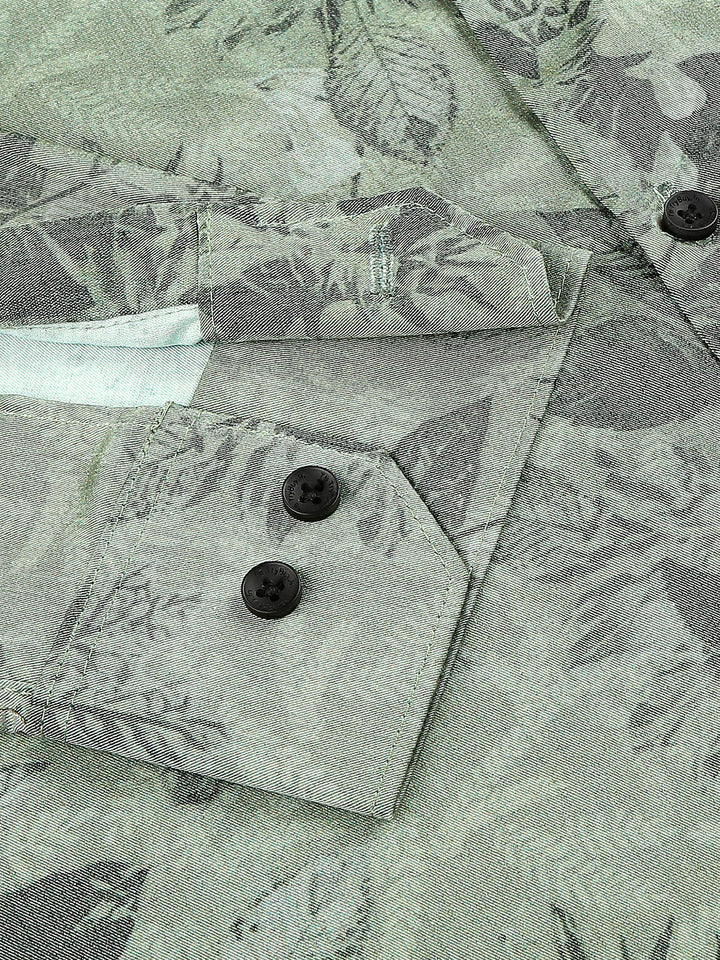 a close up of a shirt with a flower pattern