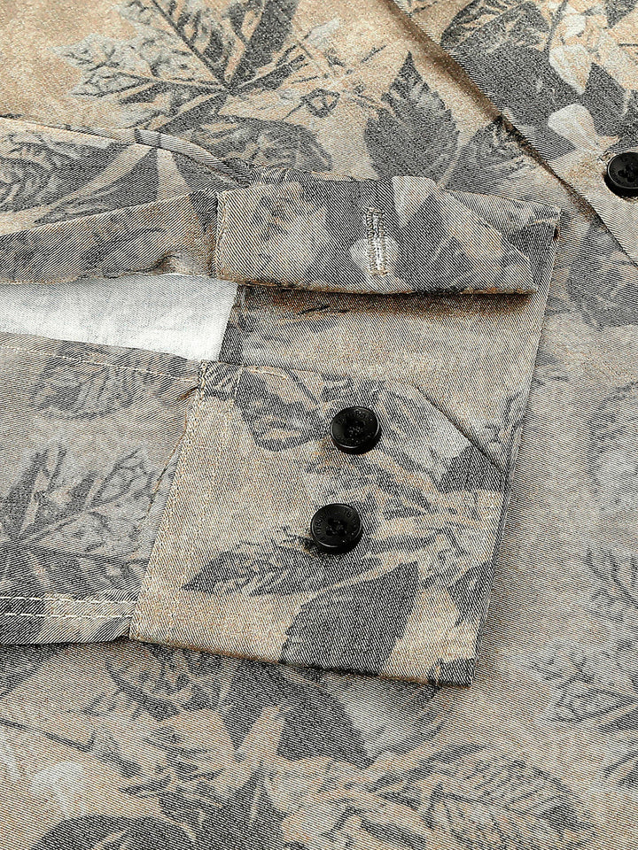 a close up of a shirt with a flower pattern