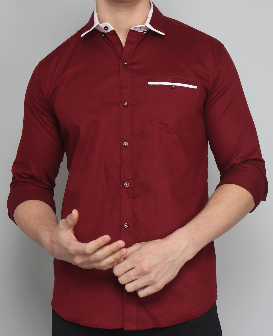 a man wearing a red shirt and black pants