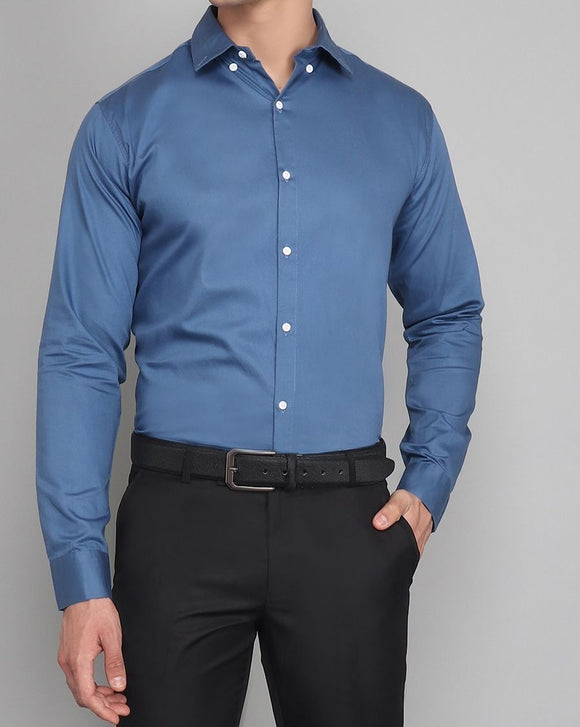 a man wearing a blue shirt and black pants