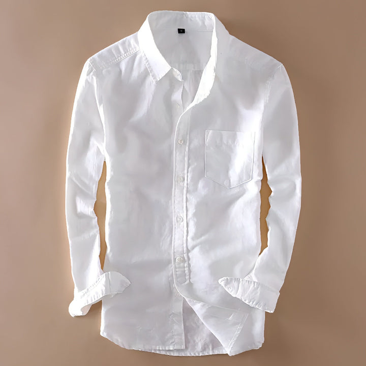 a white shirt hanging on a wall