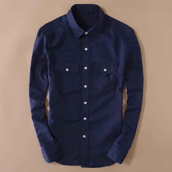 a blue shirt hanging on a wall