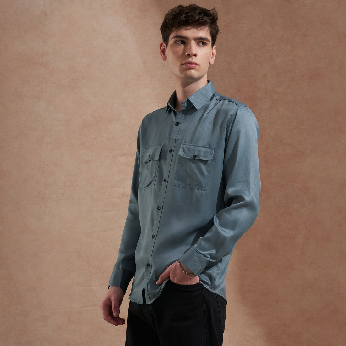 Men's blue solid slim-fit shirt with dual flap pockets, product view