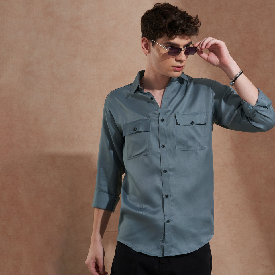 Men's blue solid slim-fit shirt with dual flap pockets, product view