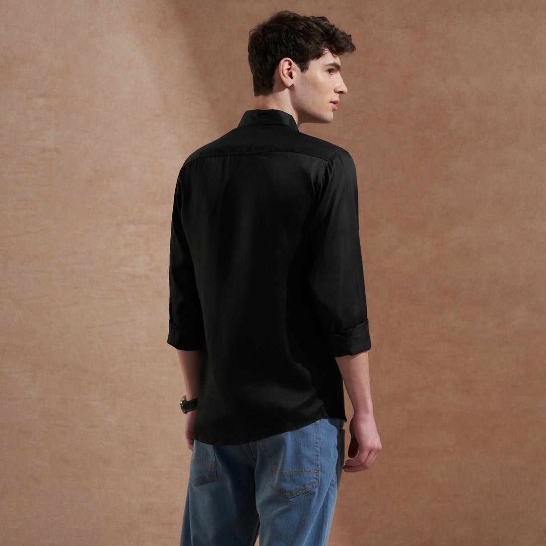Men's black solid slim-fit shirt with dual flap pockets, product view