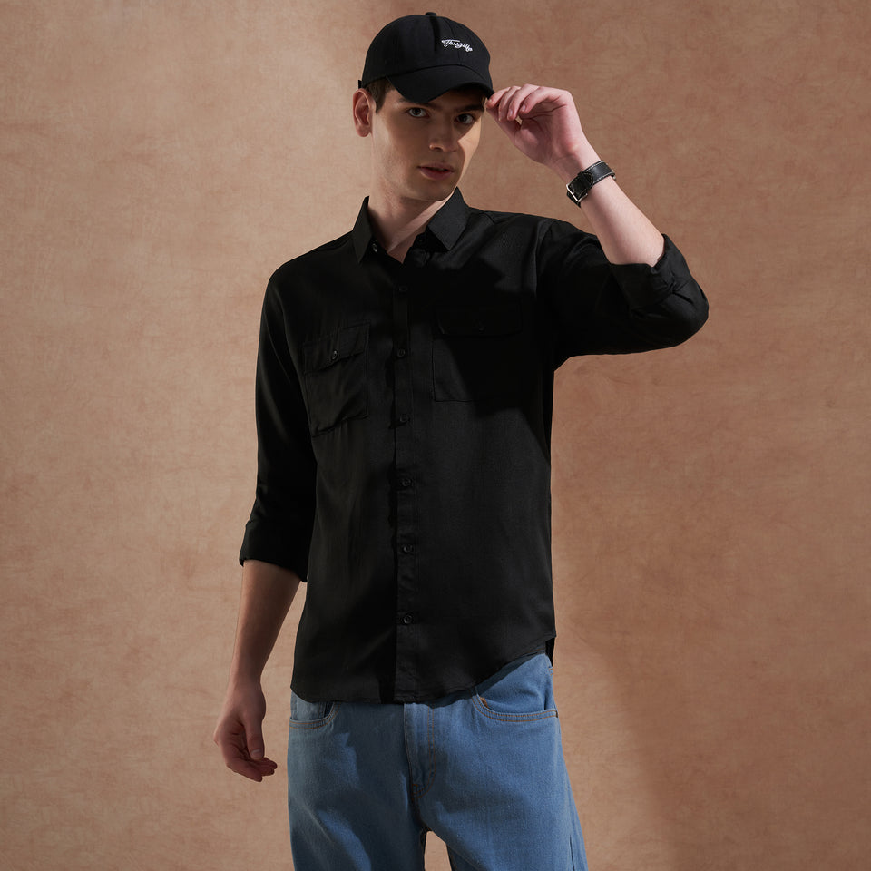 Men's black solid slim-fit shirt with dual flap pockets, product view
