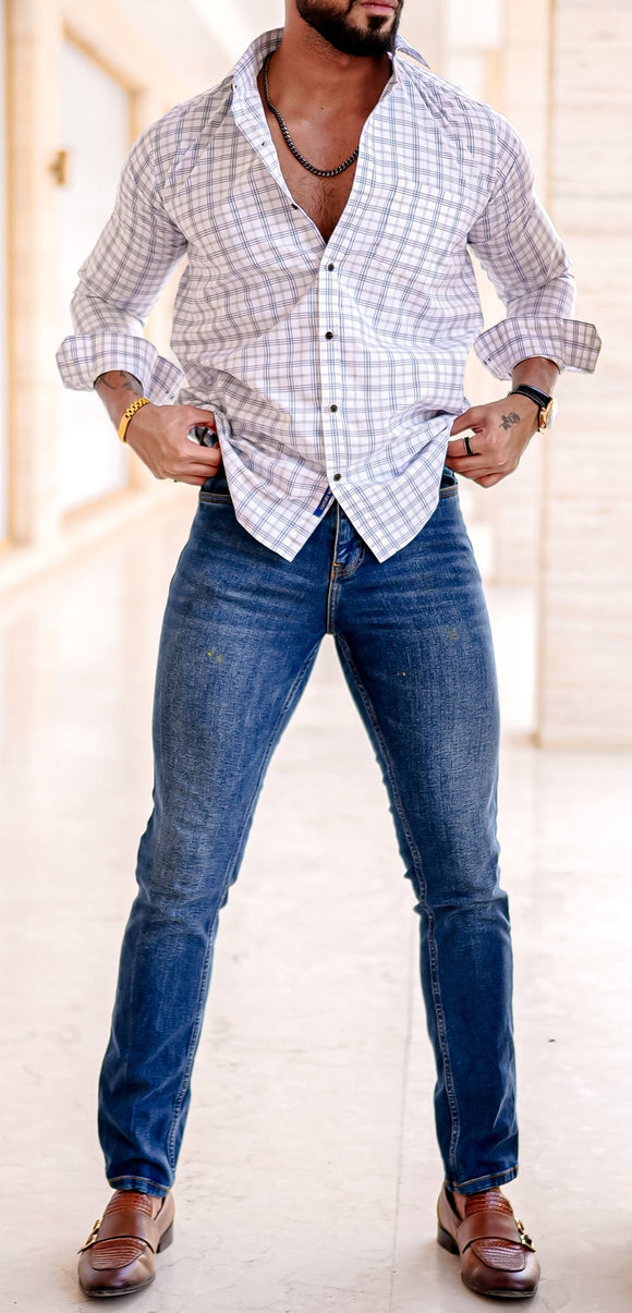 a man standing in a room with his hands on his hips