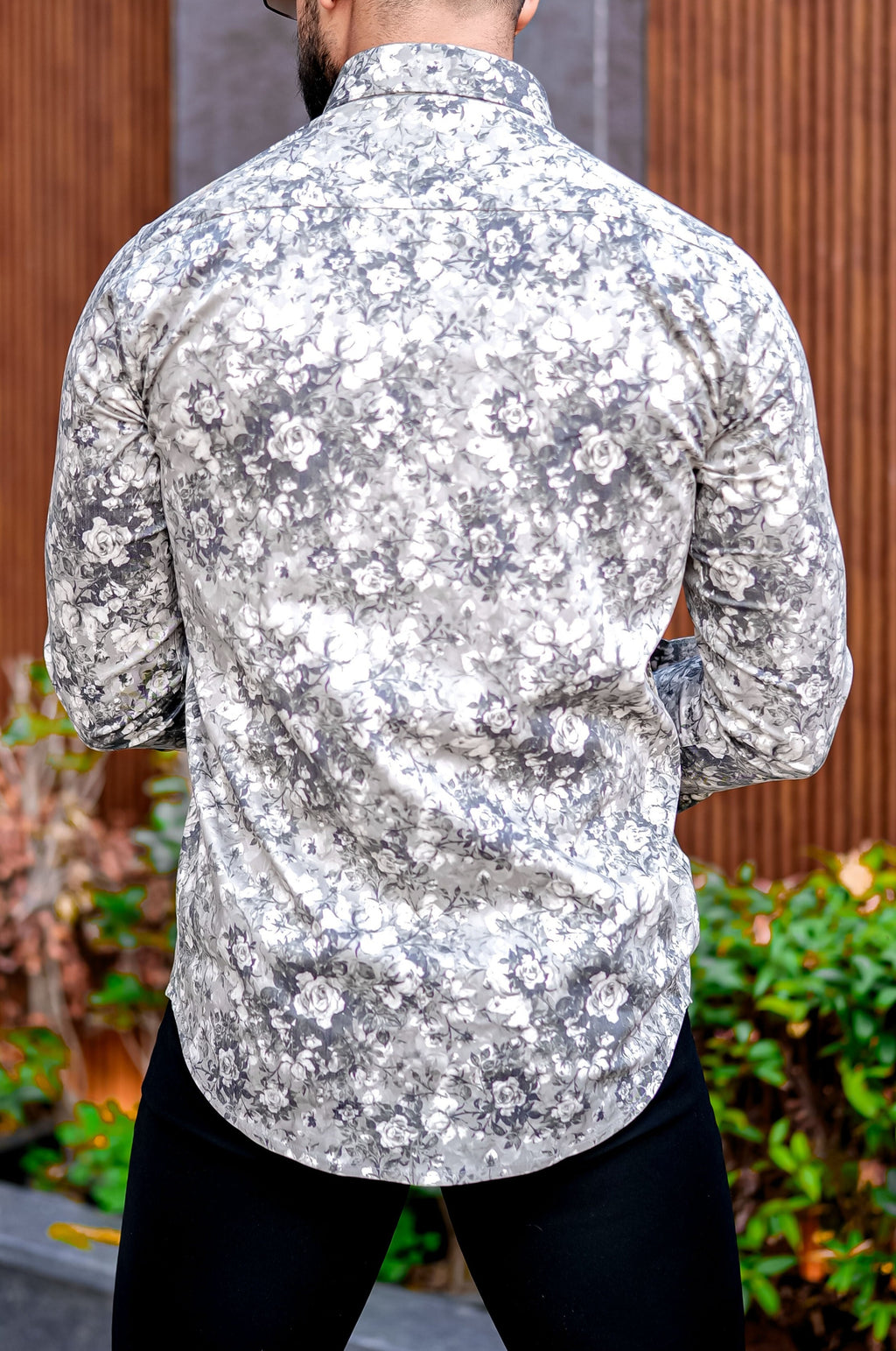 a man with a beard wearing a hat