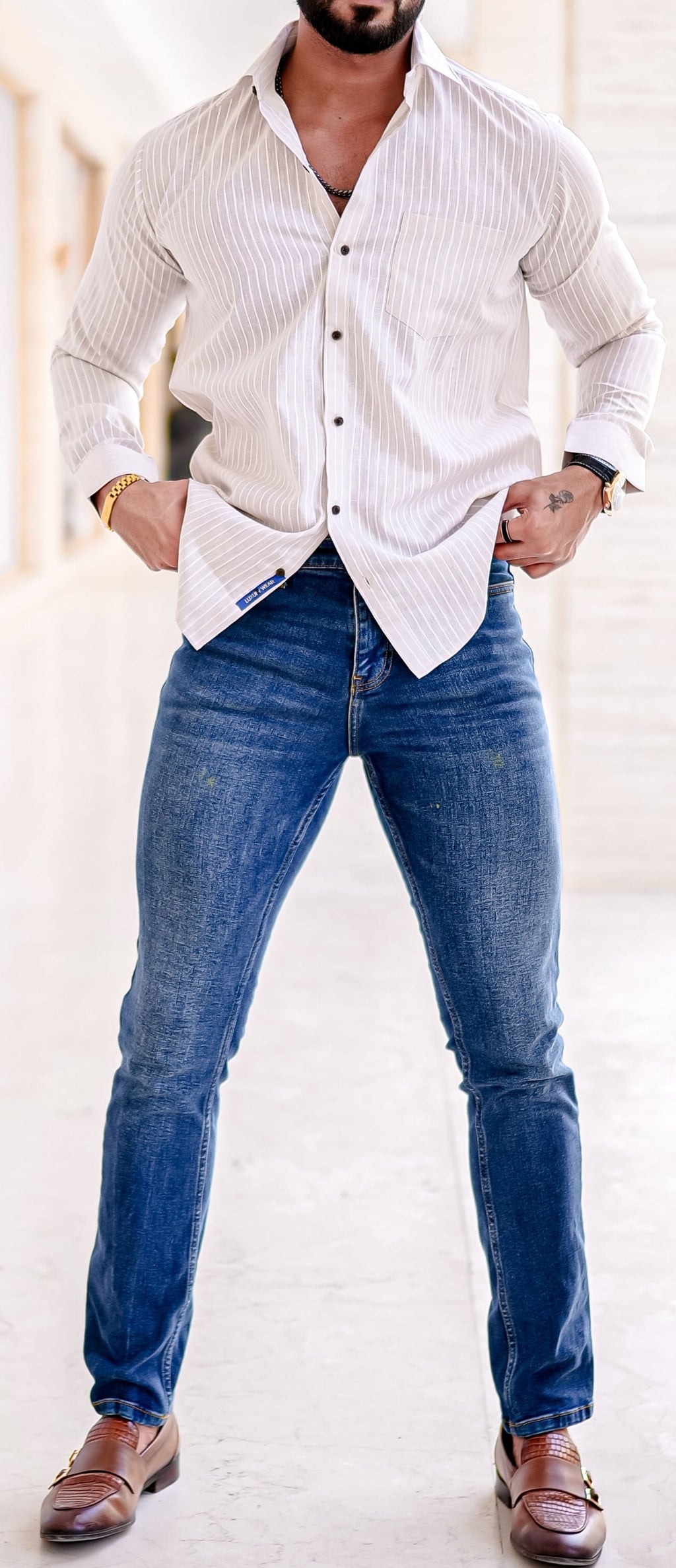 a man standing with his hands on his hips