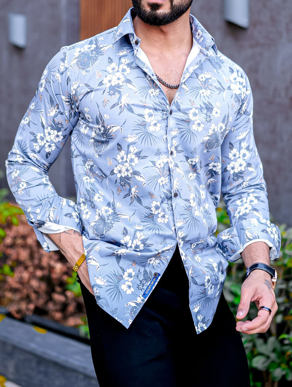 a man wearing a blue shirt and black pants