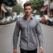 a man walking down the street in a shirt