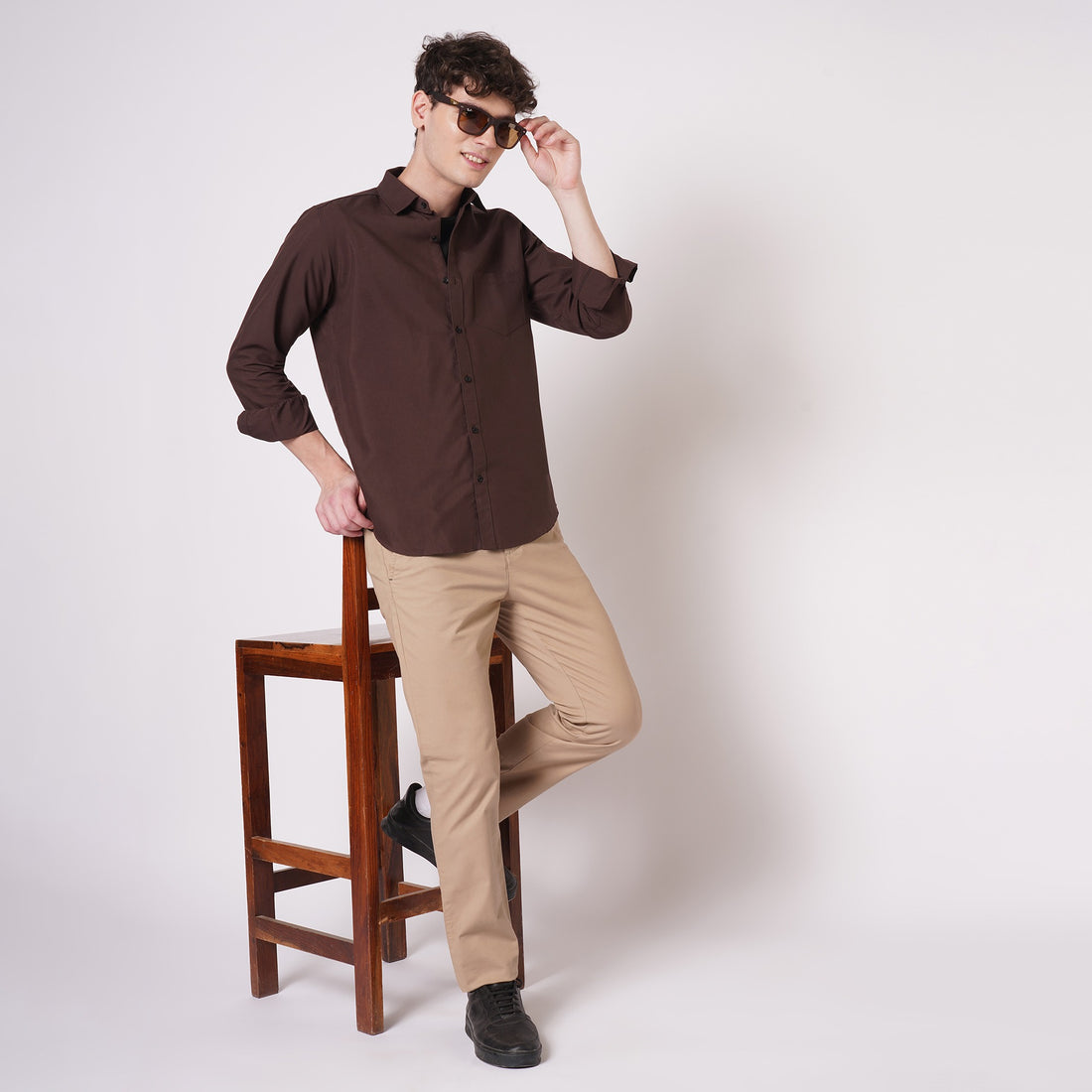 Chocolate brown cotton shirt for men styled with beige trousers