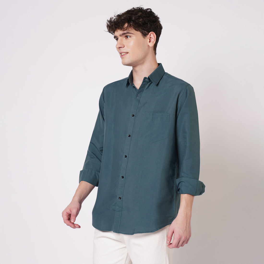 Teal green men's solid shirt angled front view