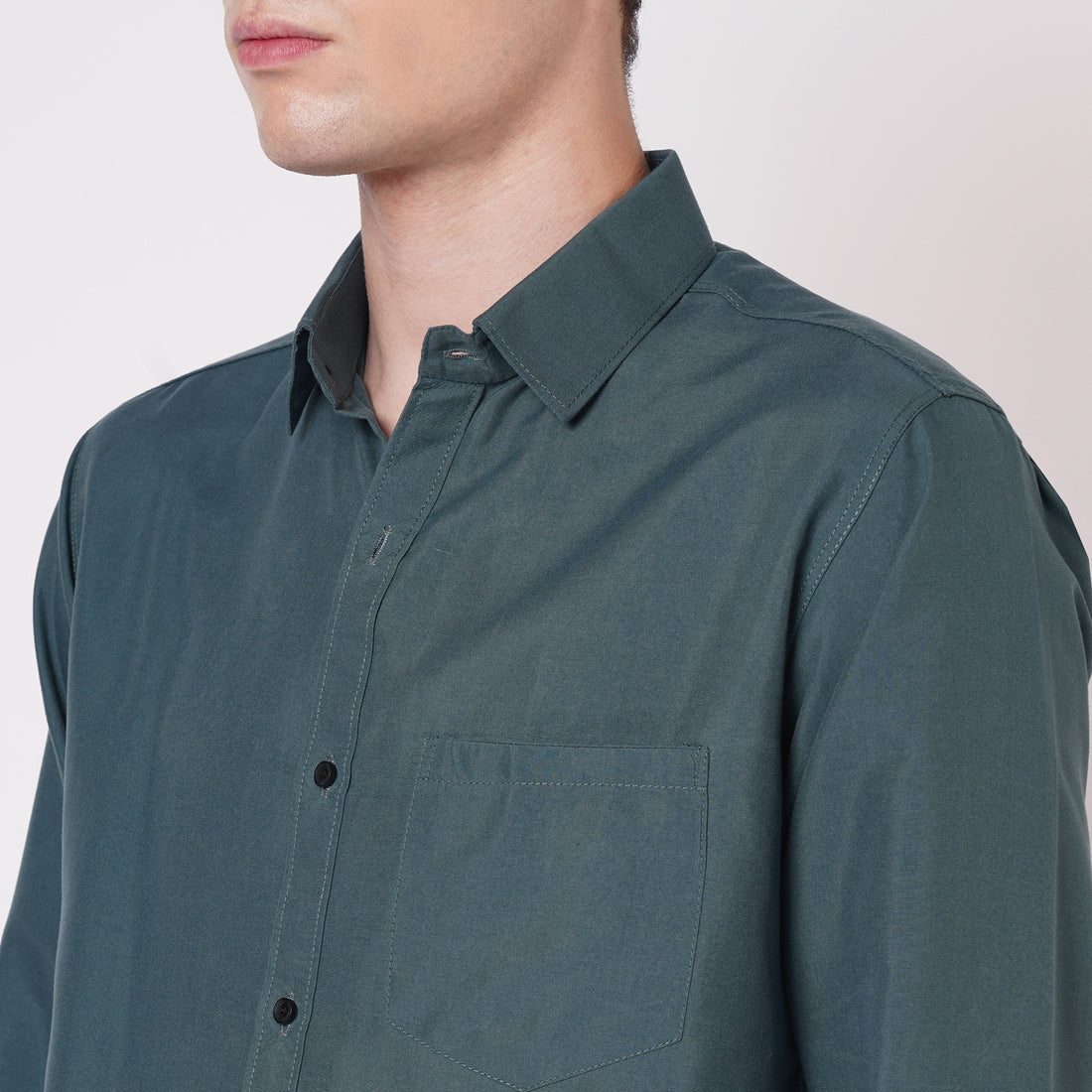 Teal green men's solid shirt collar and chest pocket detail