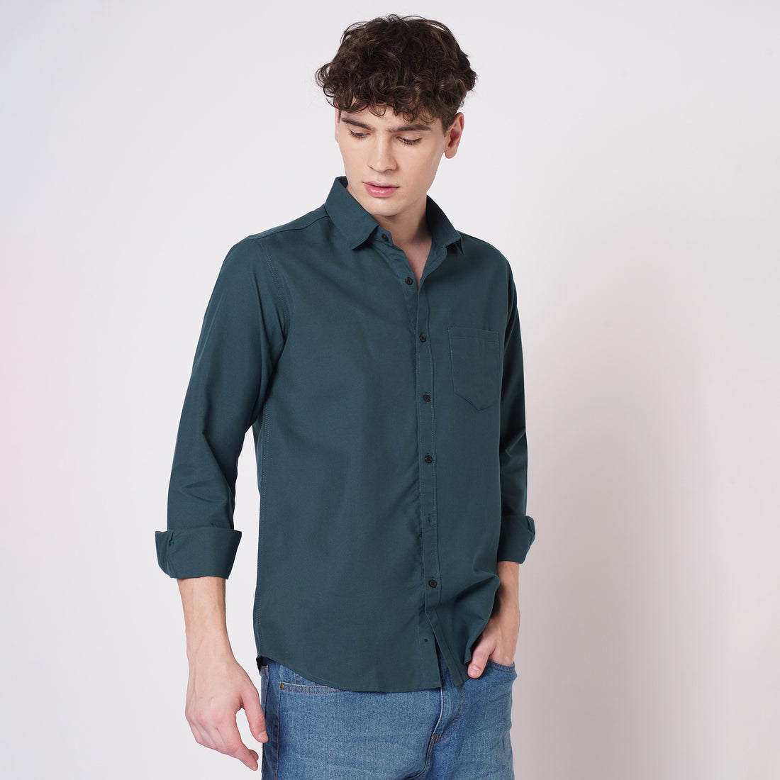 Men's deep teal solid shirt angled front view