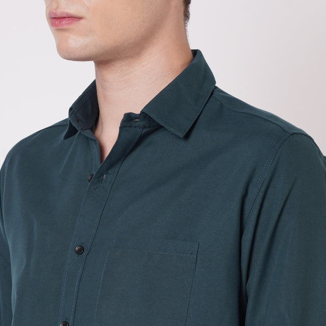 Deep teal men's solid shirt collar and chest pocket detail