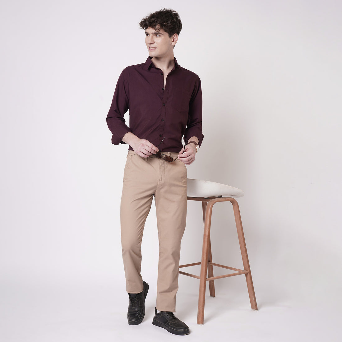 Wine maroon cotton shirt for men styled with beige trousers