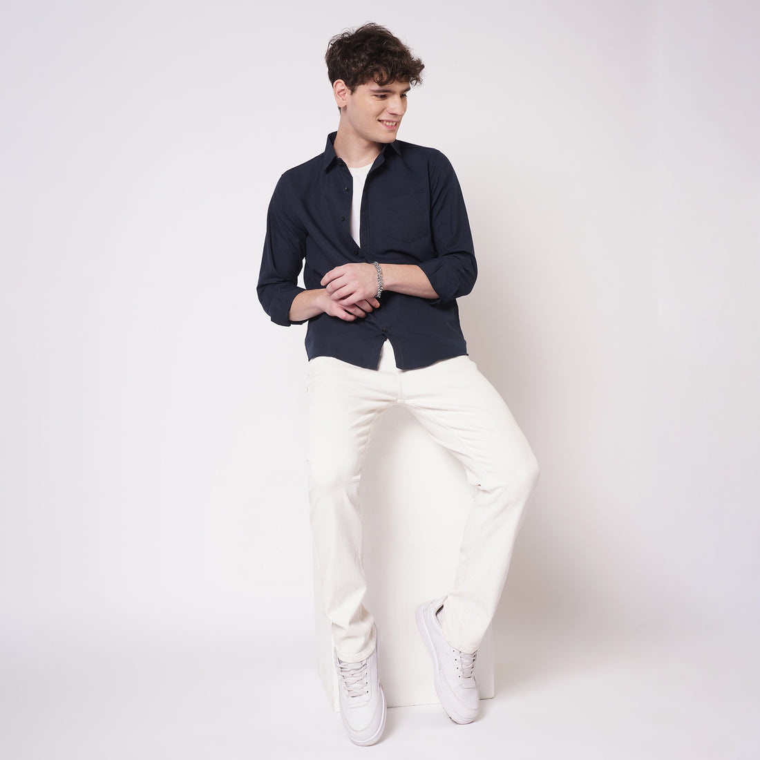 Navy blue cotton shirt for men styled with white trousers full view