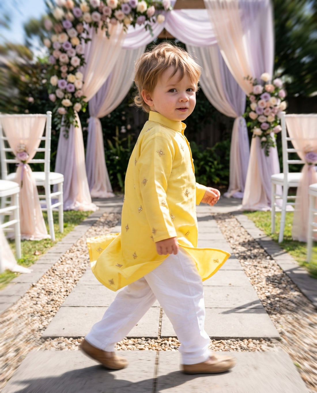 TryBuy TB_21114_KID, 2–3 years: Side walking view showing the yellow kurta, small gold-tone motifs and side slits