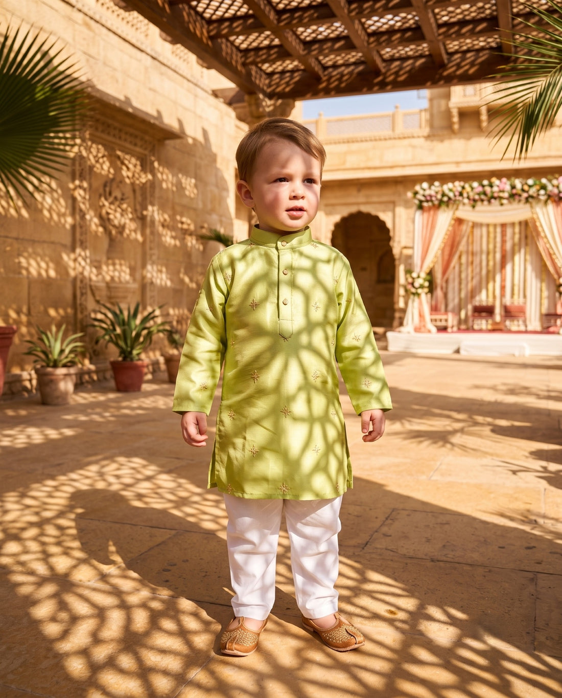 Front view of TryBuy lime green kurta for 2–3 years with gold-tone floral motifs in a haveli courtyard
