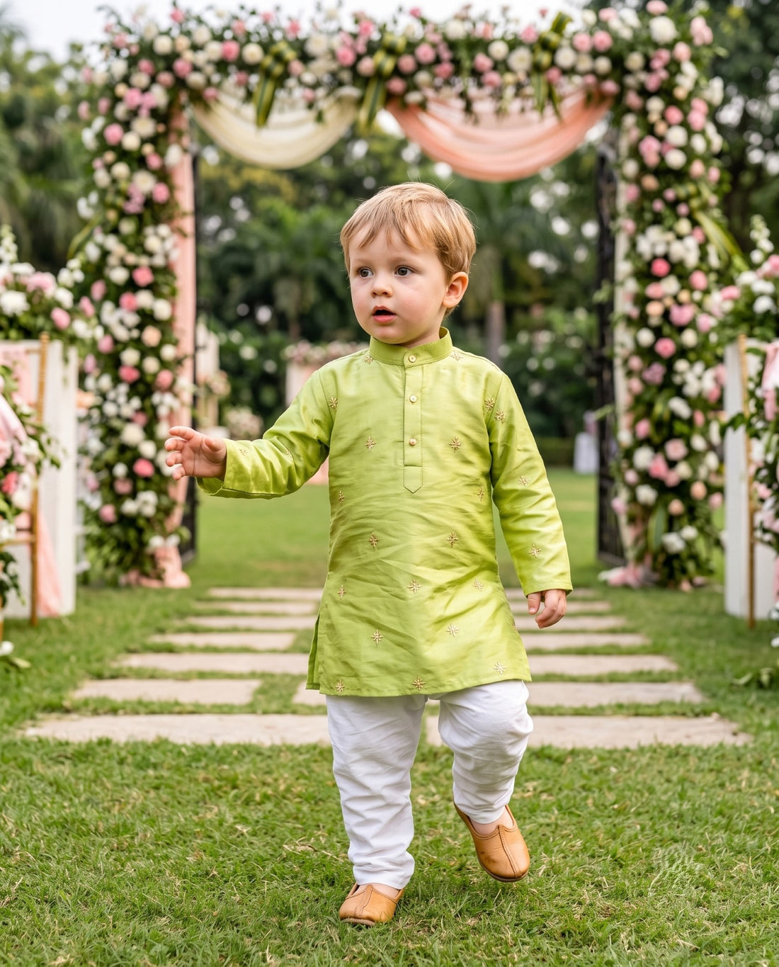 TryBuy lime green boys kurta with scattered gold-tone embroidery shown walking through a floral garden