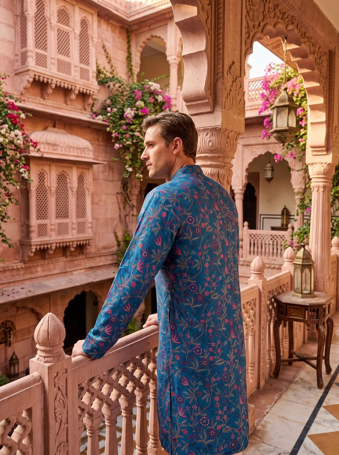 Back detail of TryBuy TB_21160 teal blue men’s kurta with continuous floral-vine embroidery over the back and sleeves.