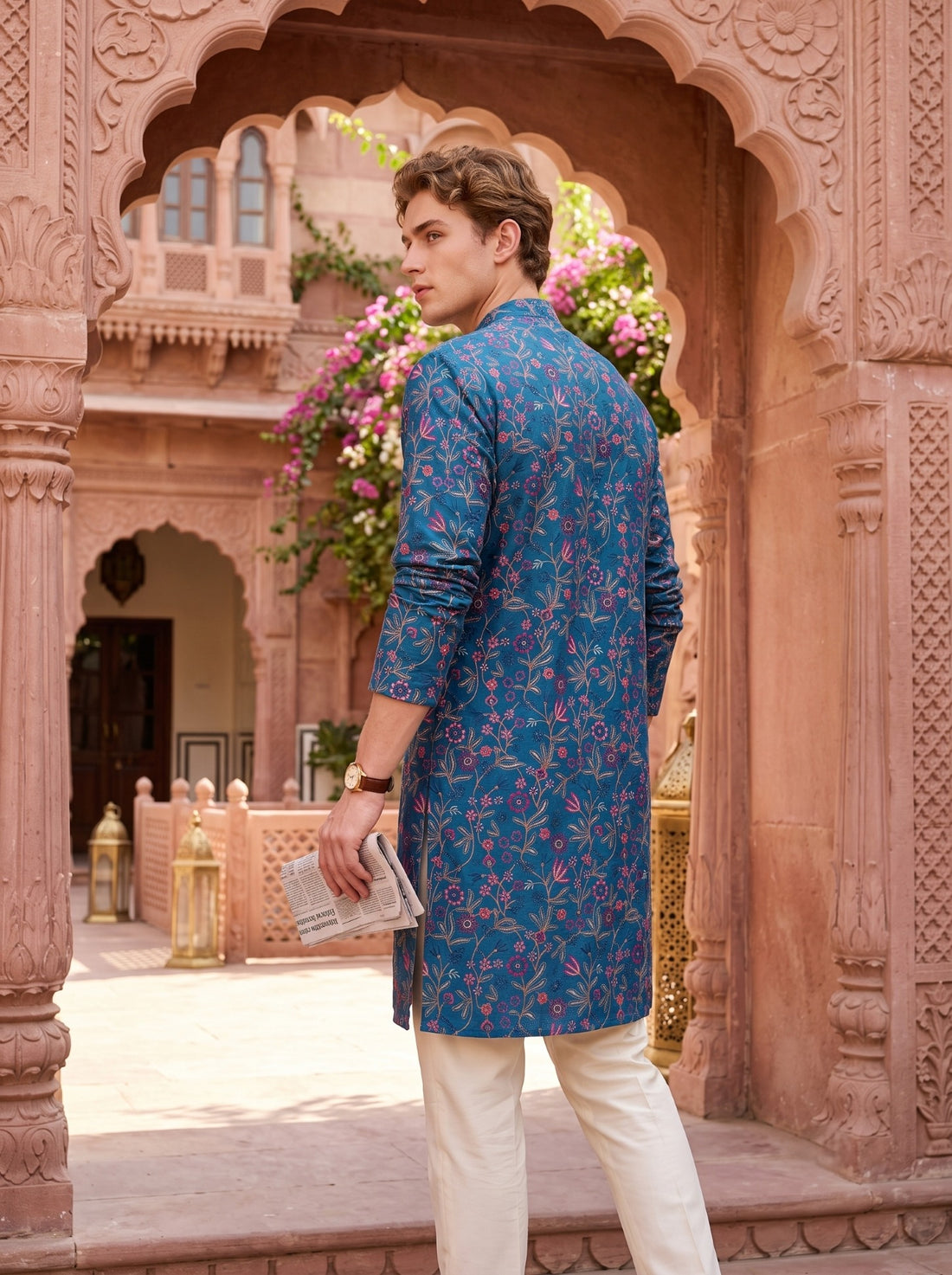 Rear three-quarter view of the teal blue TB_21160 kurta with all-over floral-vine embroidery.