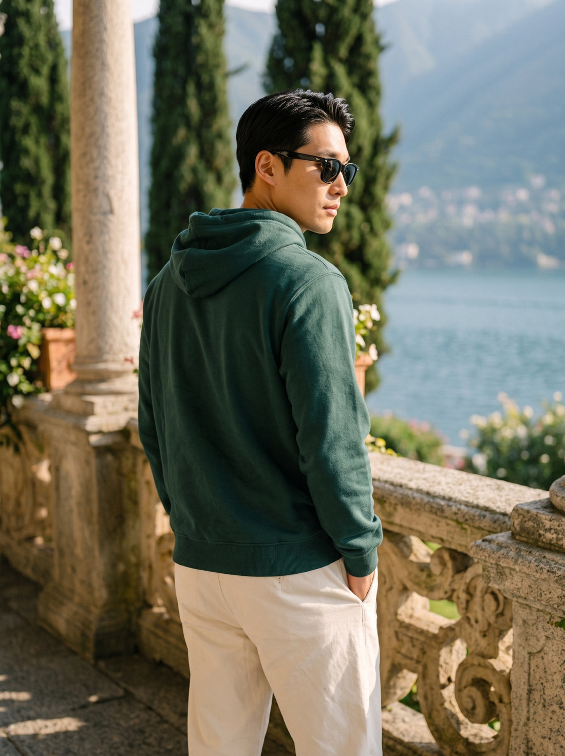 
Men's forest green cotton pullover hoodie, rear three-quarter view
