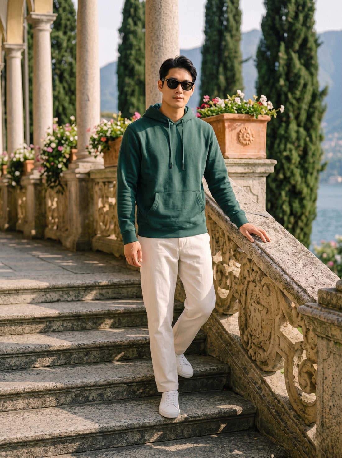 
Men's forest green cotton pullover hoodie, full-length front stairway view
