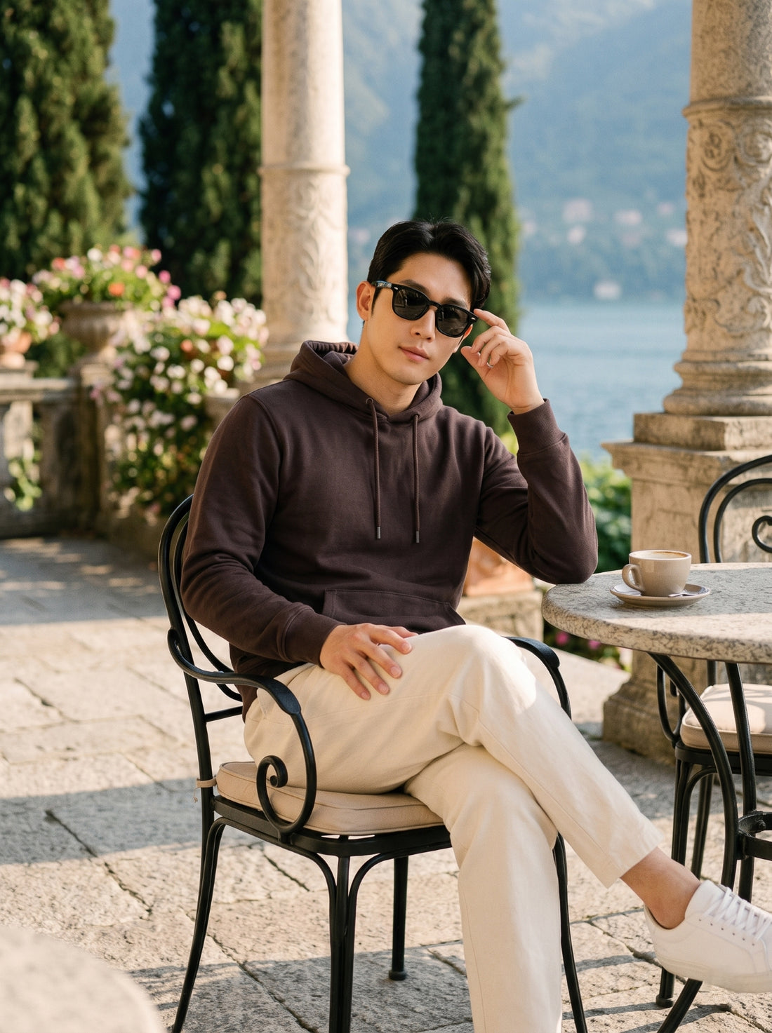 
Men's chocolate brown cotton pullover hoodie, seated front lifestyle view
