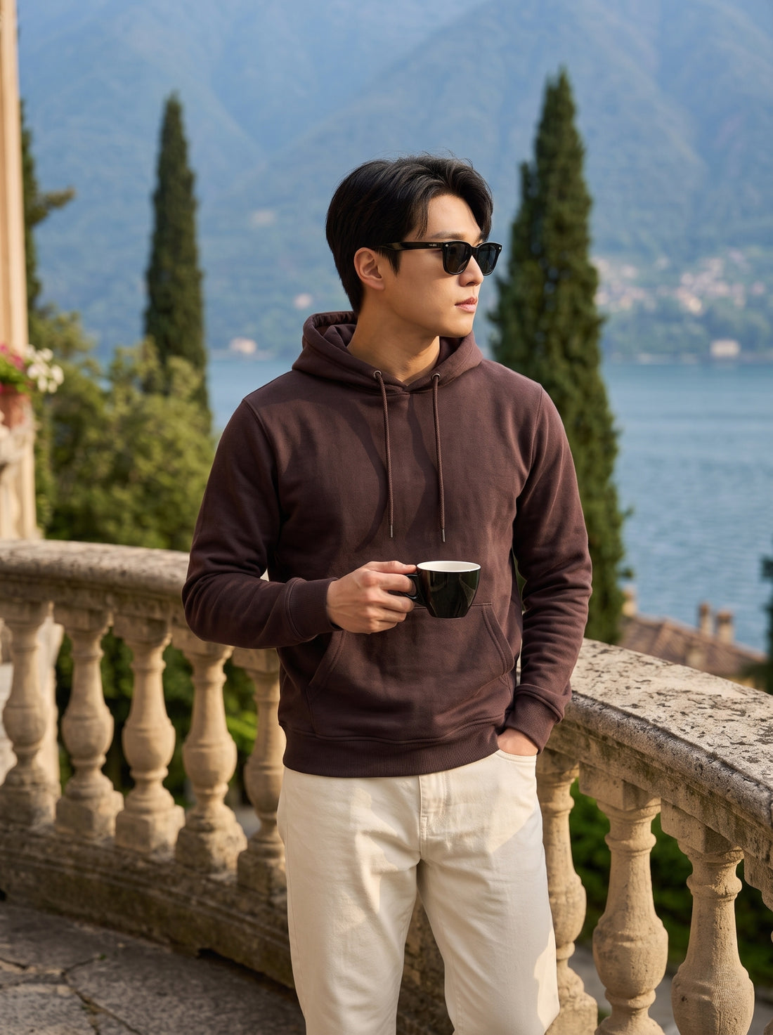 
Men's chocolate brown cotton pullover hoodie, front mid-length lifestyle view
