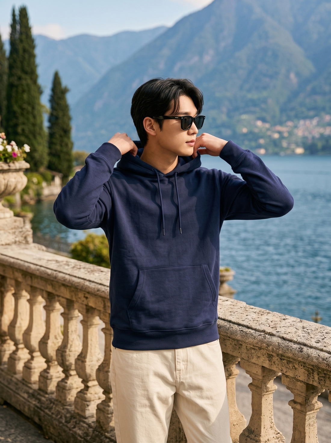 
Men's navy blue cotton pullover hoodie, front hood detail lifestyle view
