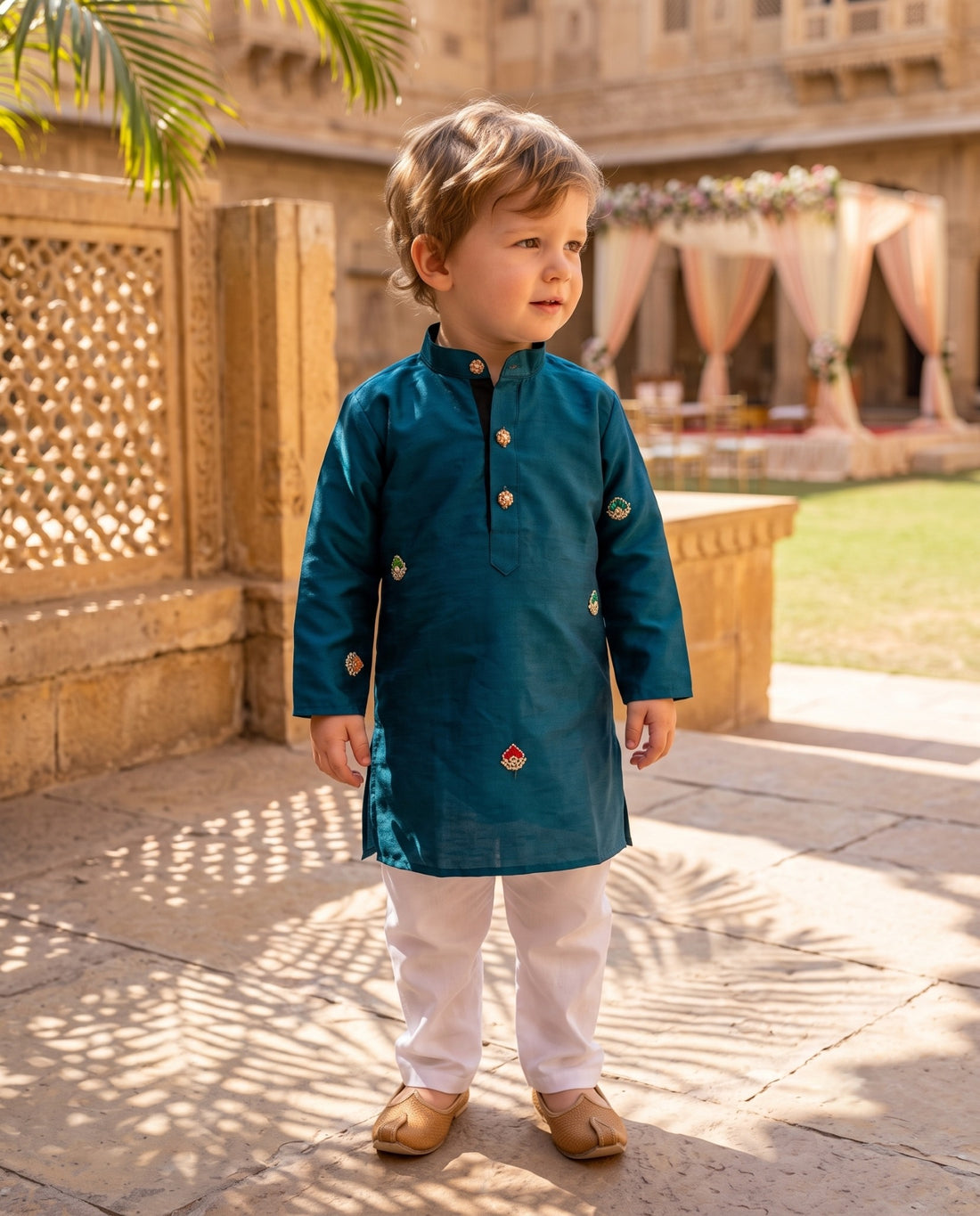 Three-quarter view of TryBuy teal-blue boys kurta with mandarin collar and multicolour motifs