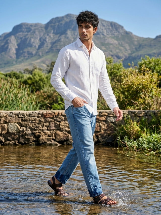 
Solid white linen shirt with denim jeans walking outdoors
