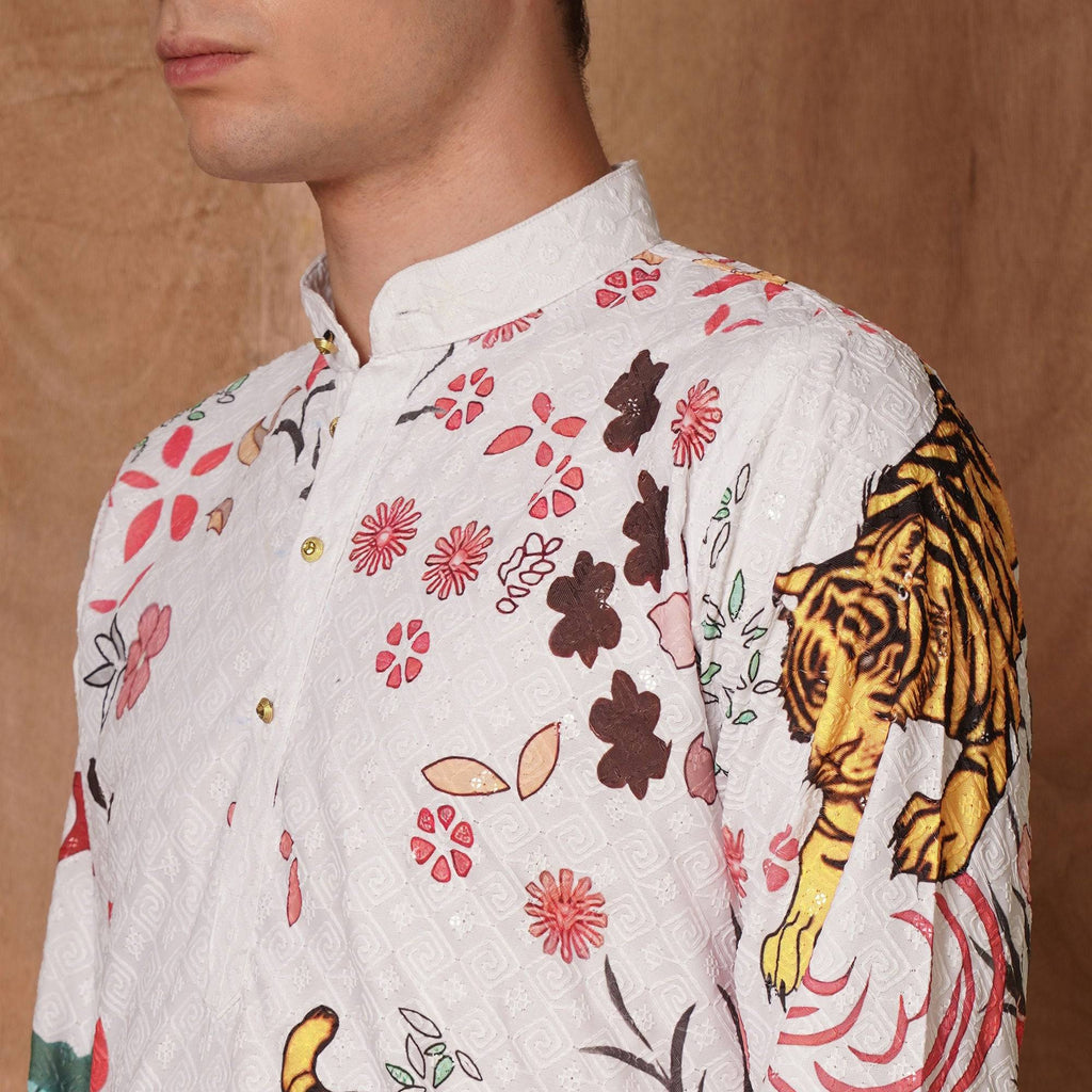 Close-up of collar and upper chest of men's tiger print Chikankari kurta, highlighting detailed embroidery and festive design.