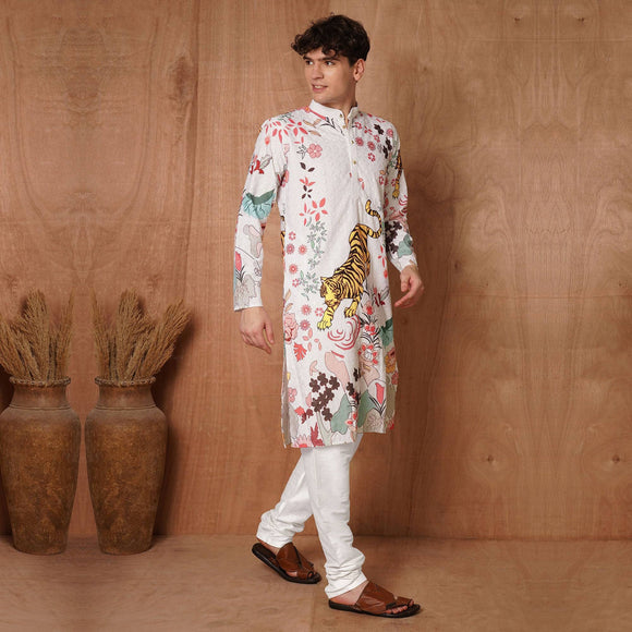 Side pose of man in white designer kurta with colorful tiger and floral print, perfect for cultural and festive occasions.