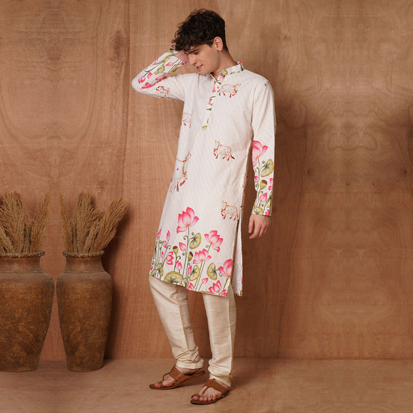 Full-length view of men's cream Chikankari Kurta with lotus and cow motifs, crafted in soft cotton blend for festive occasions.