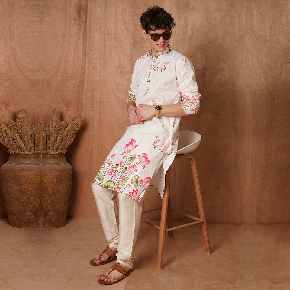 Men's Chikankari Kurta - Divine Cows Lotus in cream with hand-painted cow and lotus motifs, styled with churidar pants for festive wear.