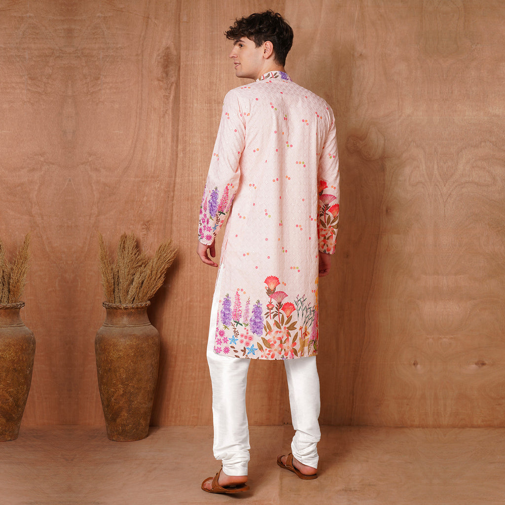 Back view of Men’s Ethnic Pink Chikankari Kurta featuring vibrant floral print at the hem. Traditional attire for weddings and festive events.