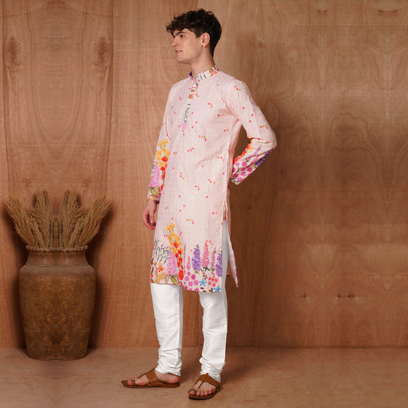 Side profile of Men’s Ethnic Pink Chikankari Kurta showcasing floral hem and sleeve design. Perfect for traditional and ceremonial clothing.
