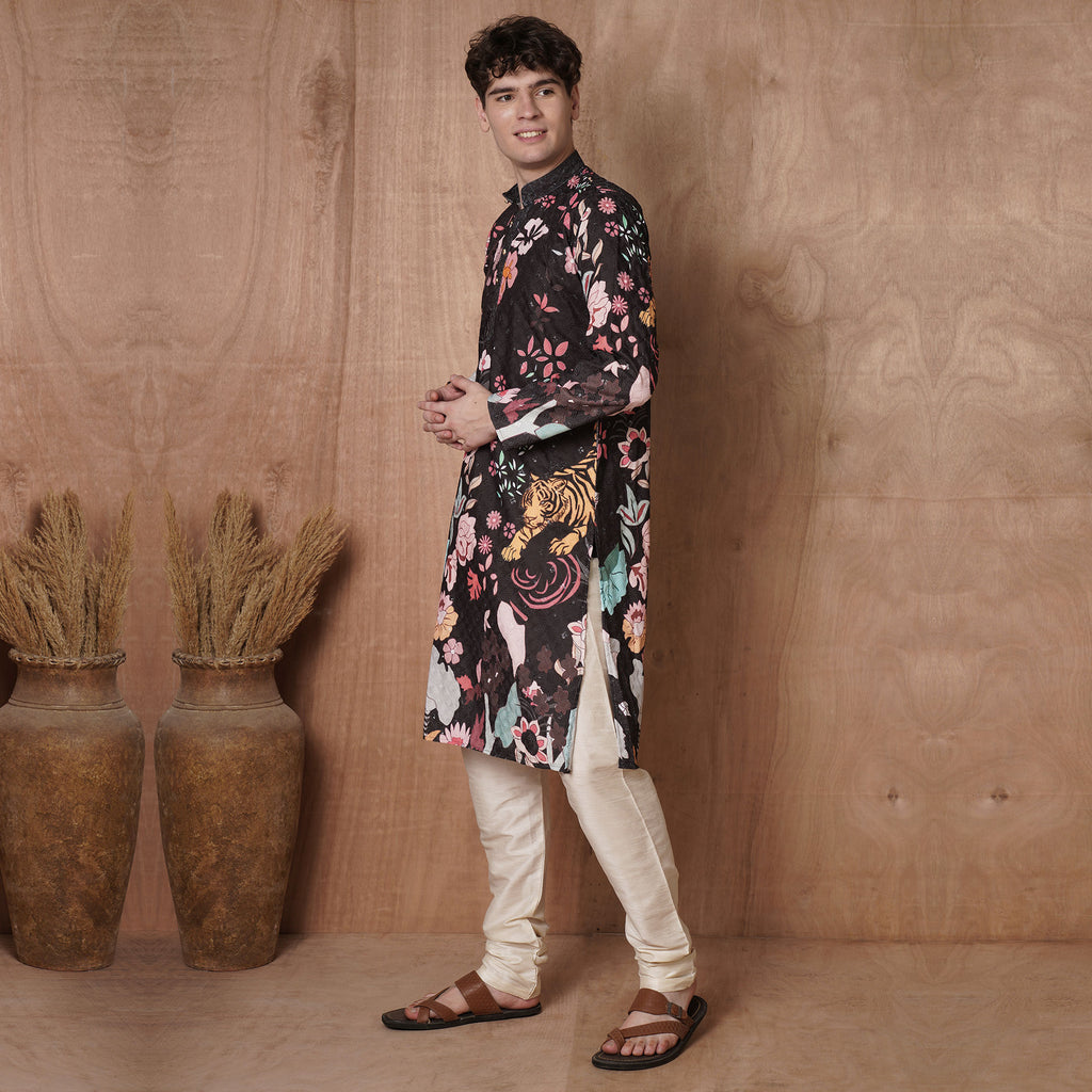 Side pose of men’s black kurta with vibrant floral and tiger motifs, ideal for ethnic parties, weddings, and Diwali celebrations.