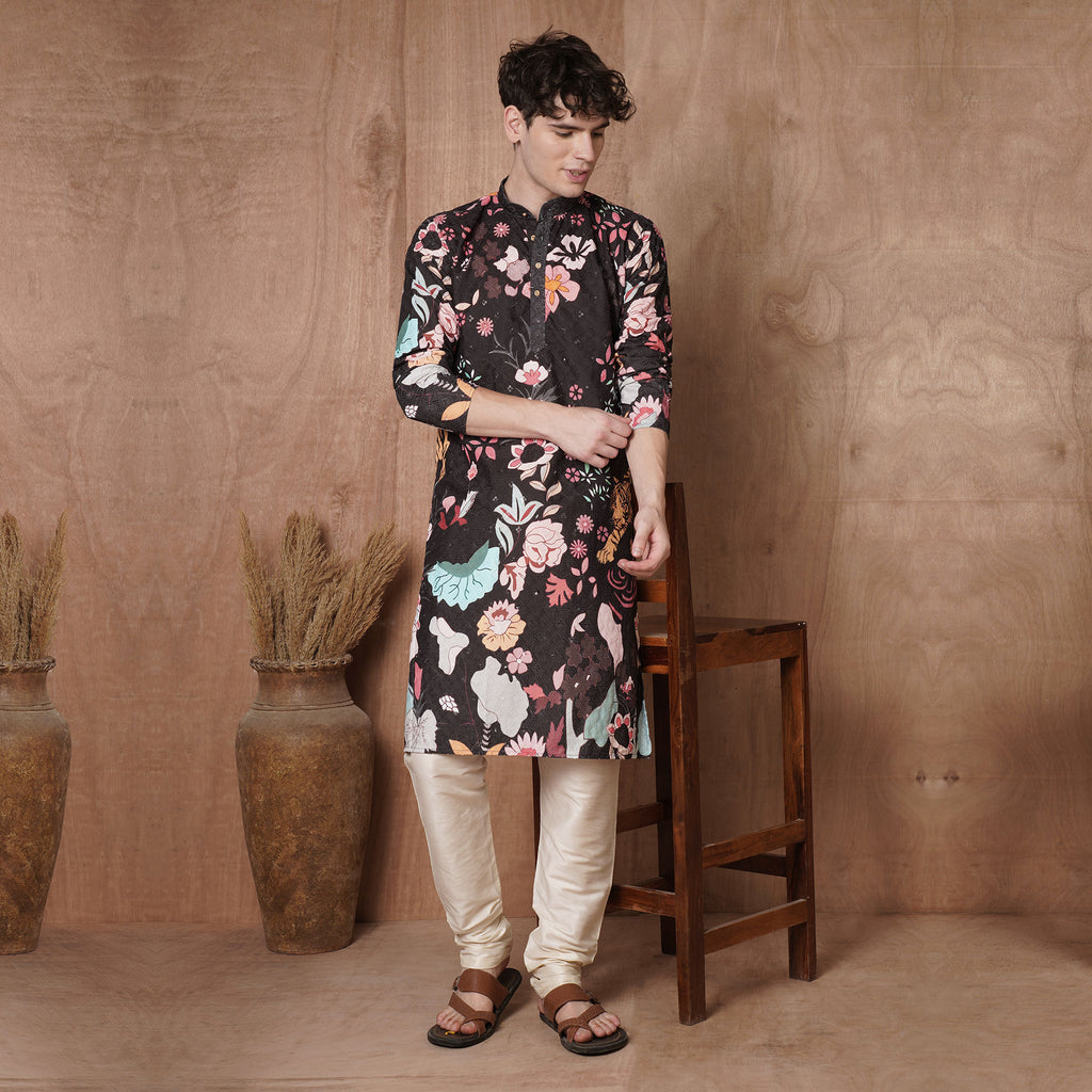 Stylish men’s black kurta with colorful floral and tiger print, perfect for festive ethnic wear during Haldi, Diwali, and weddings.