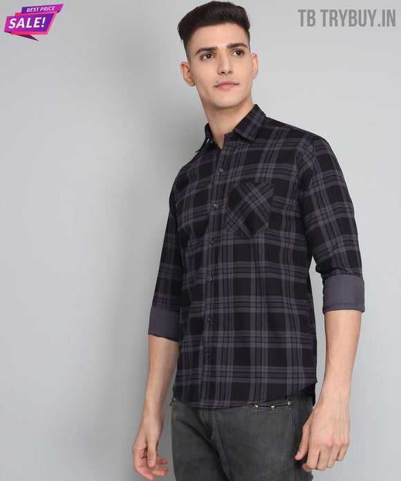 a young man wearing a black and grey plaid shirt