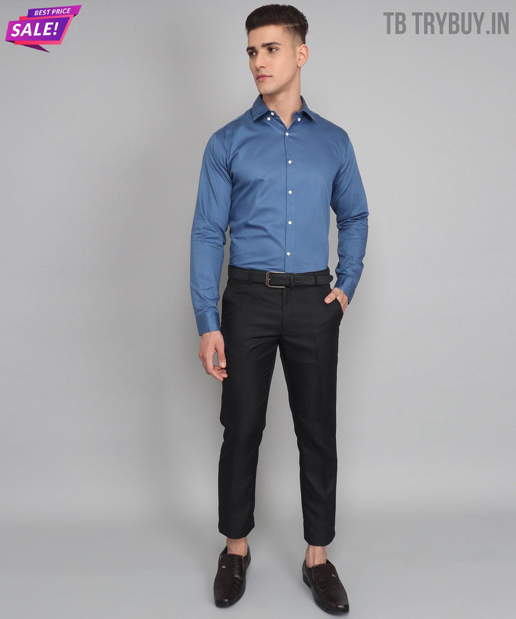 a man in a blue shirt and black pants