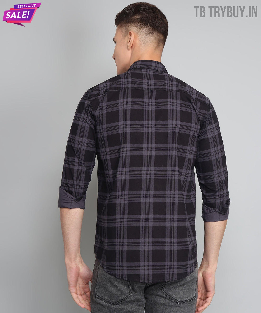 a man wearing a black and grey plaid shirt