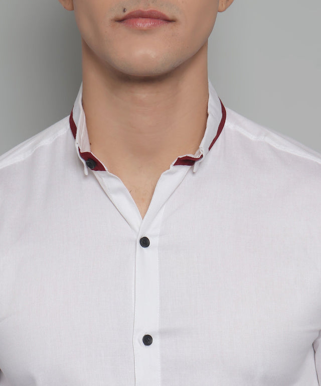 
a man wearing a white shirt and a red tie
