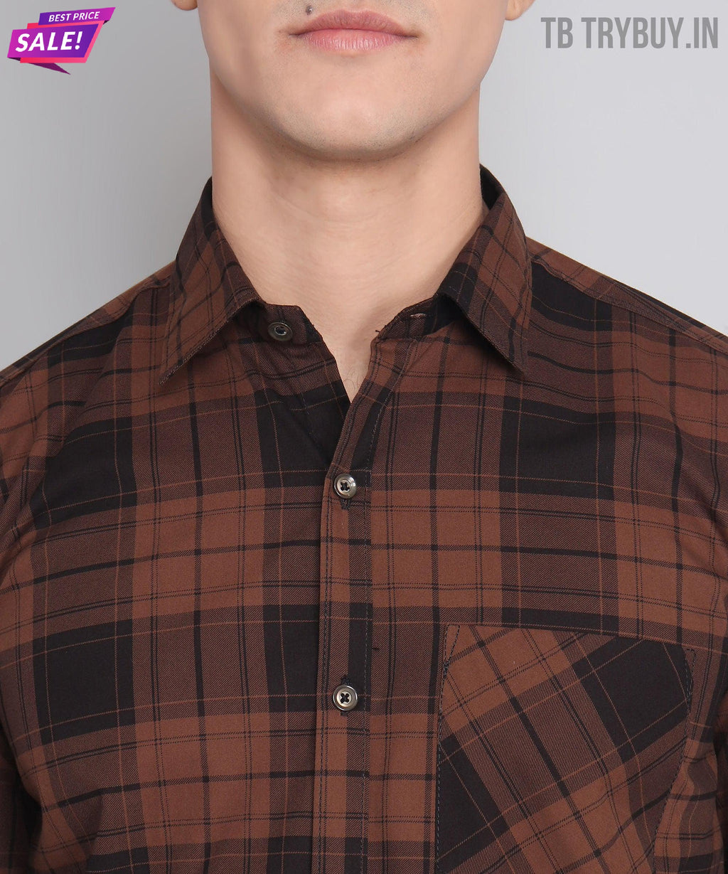 a man wearing a brown and black checkered shirt