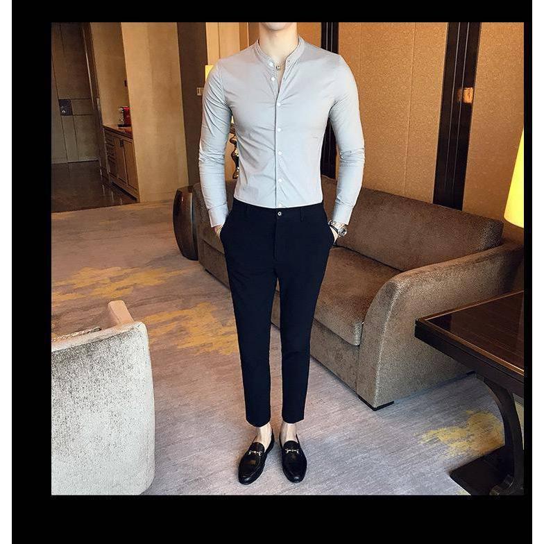 a mannequin wearing a white shirt and black pants