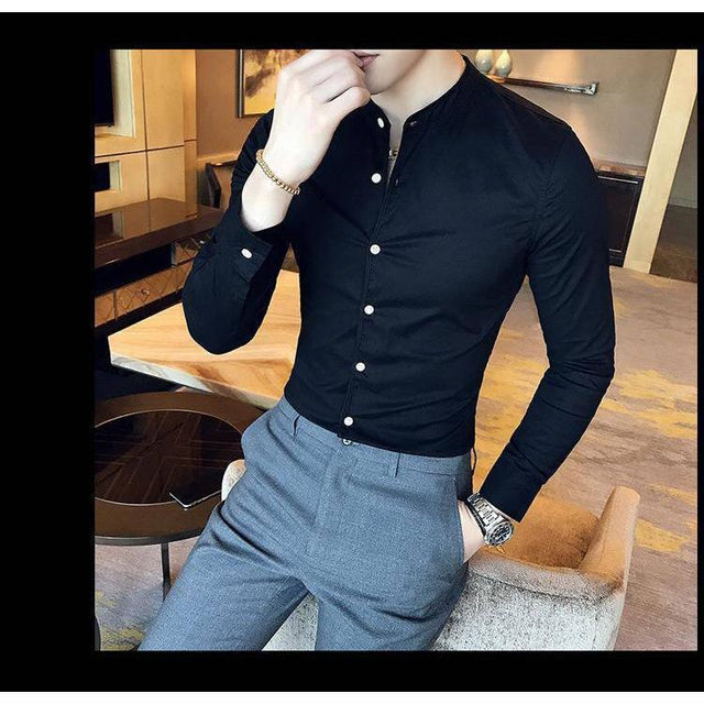 a man wearing a black shirt and grey pants