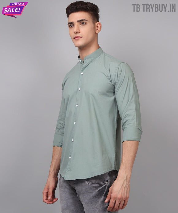 a man wearing a green shirt and jeans